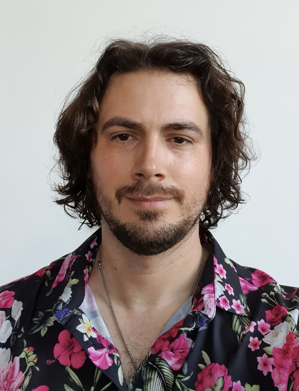 Head shot of Chris Gibson in flowery shirt