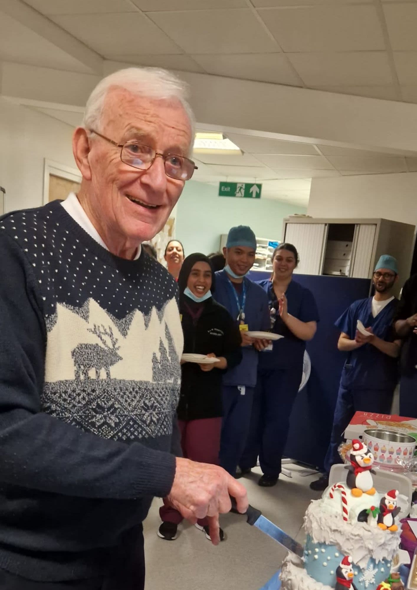 Jim cutting his cake at the birthday celebrations