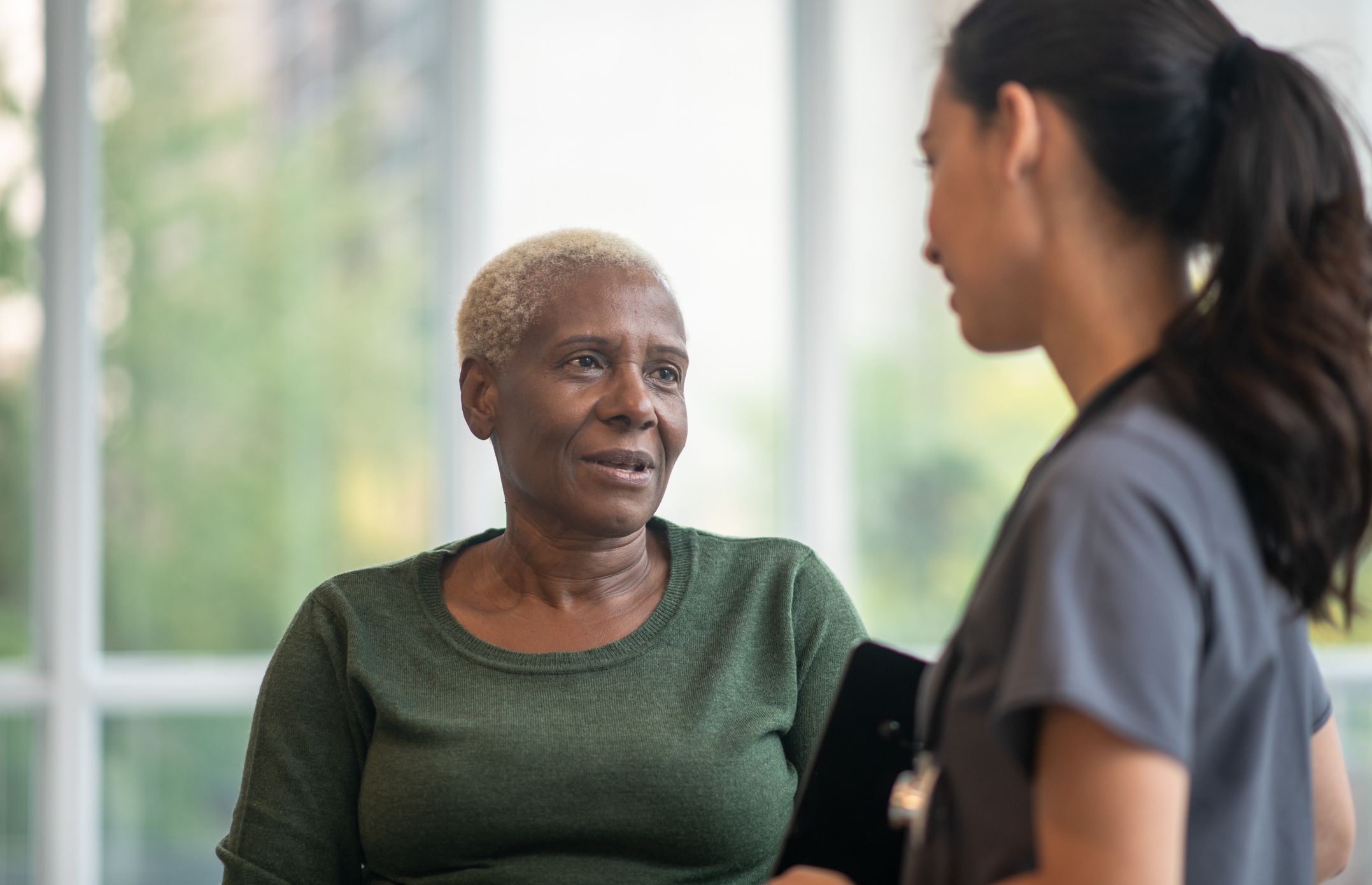 Patient talking to Radiographer