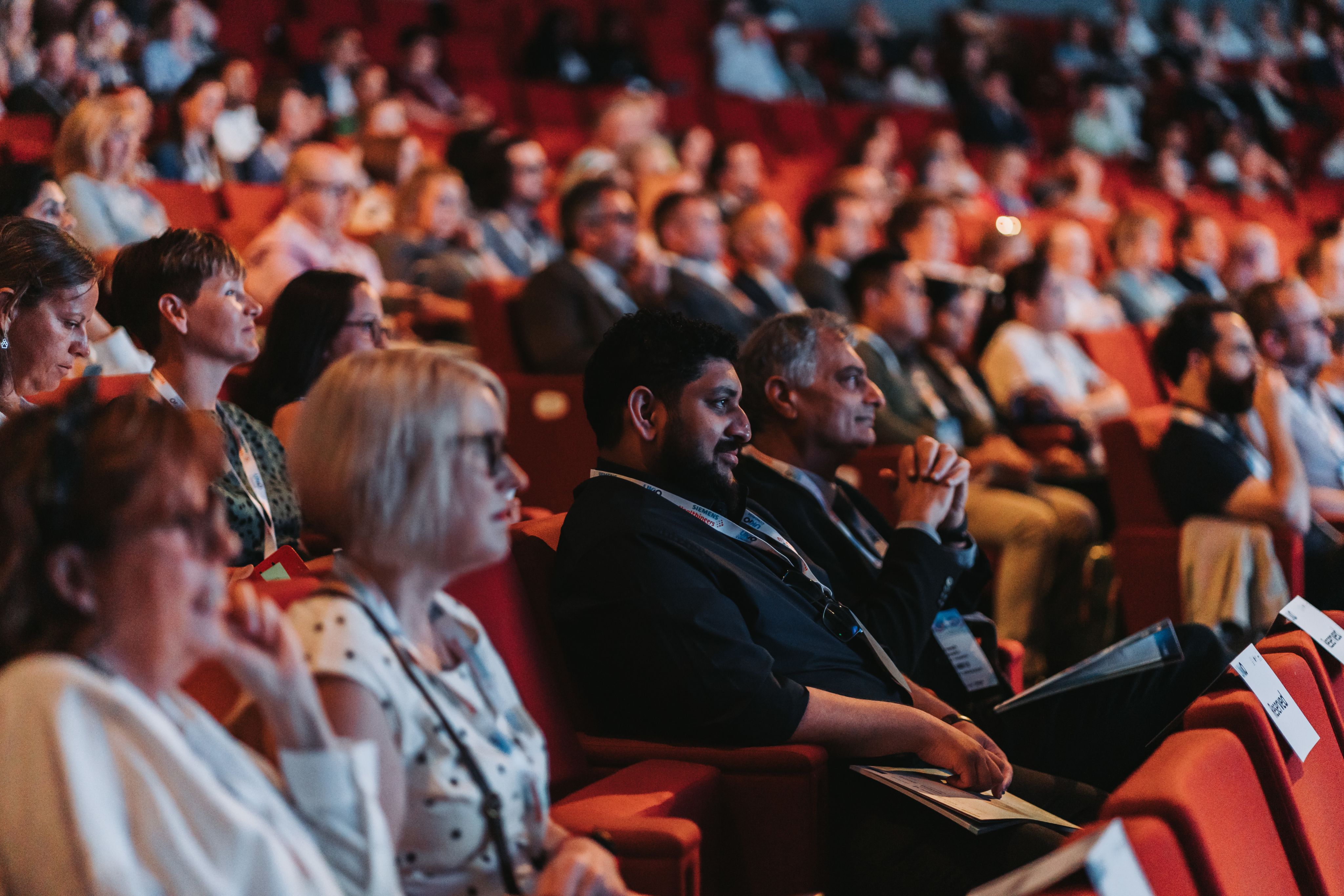 The audience enjoys the opening plenary