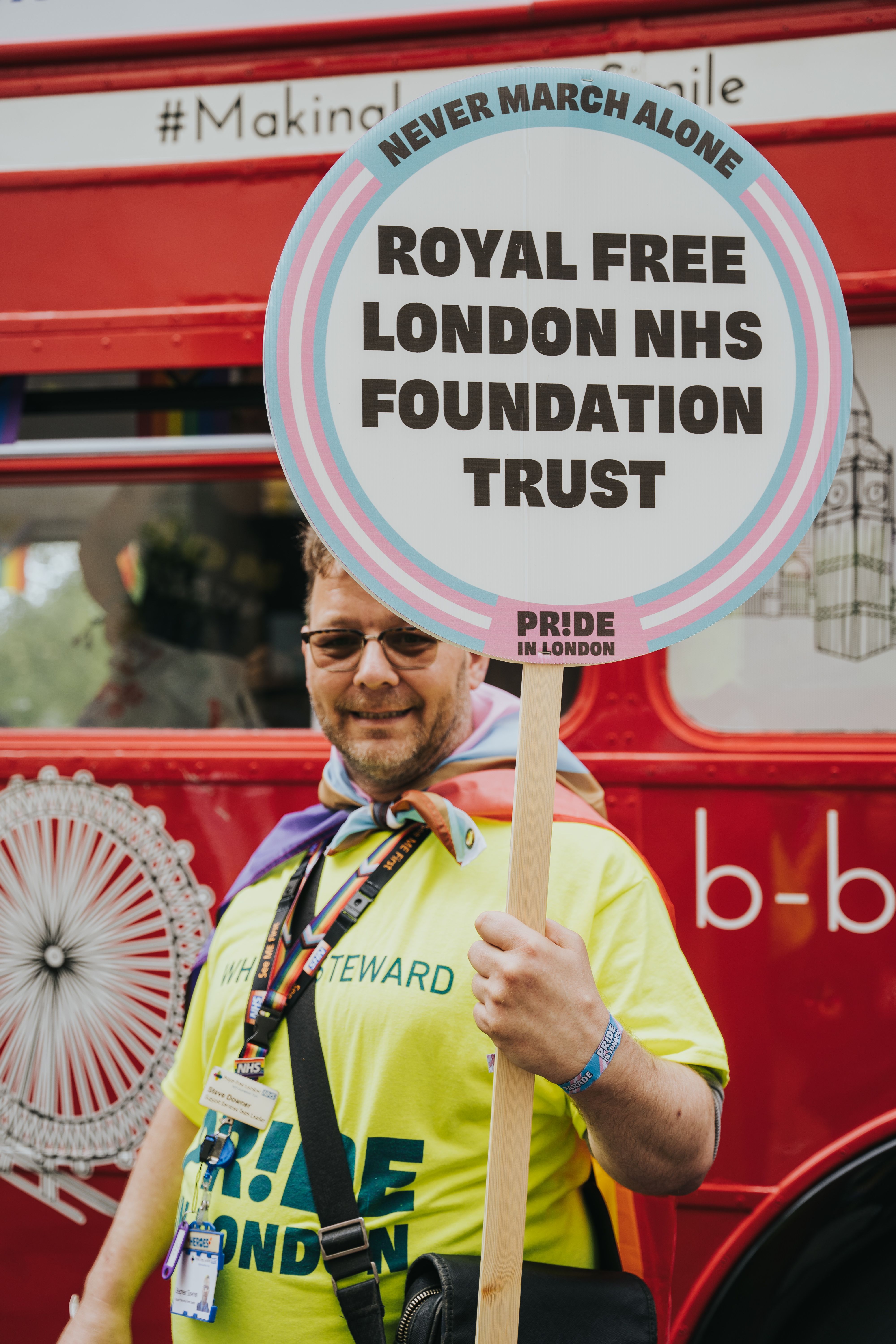 Person holding Royal Free LGBTQ+ picket sign