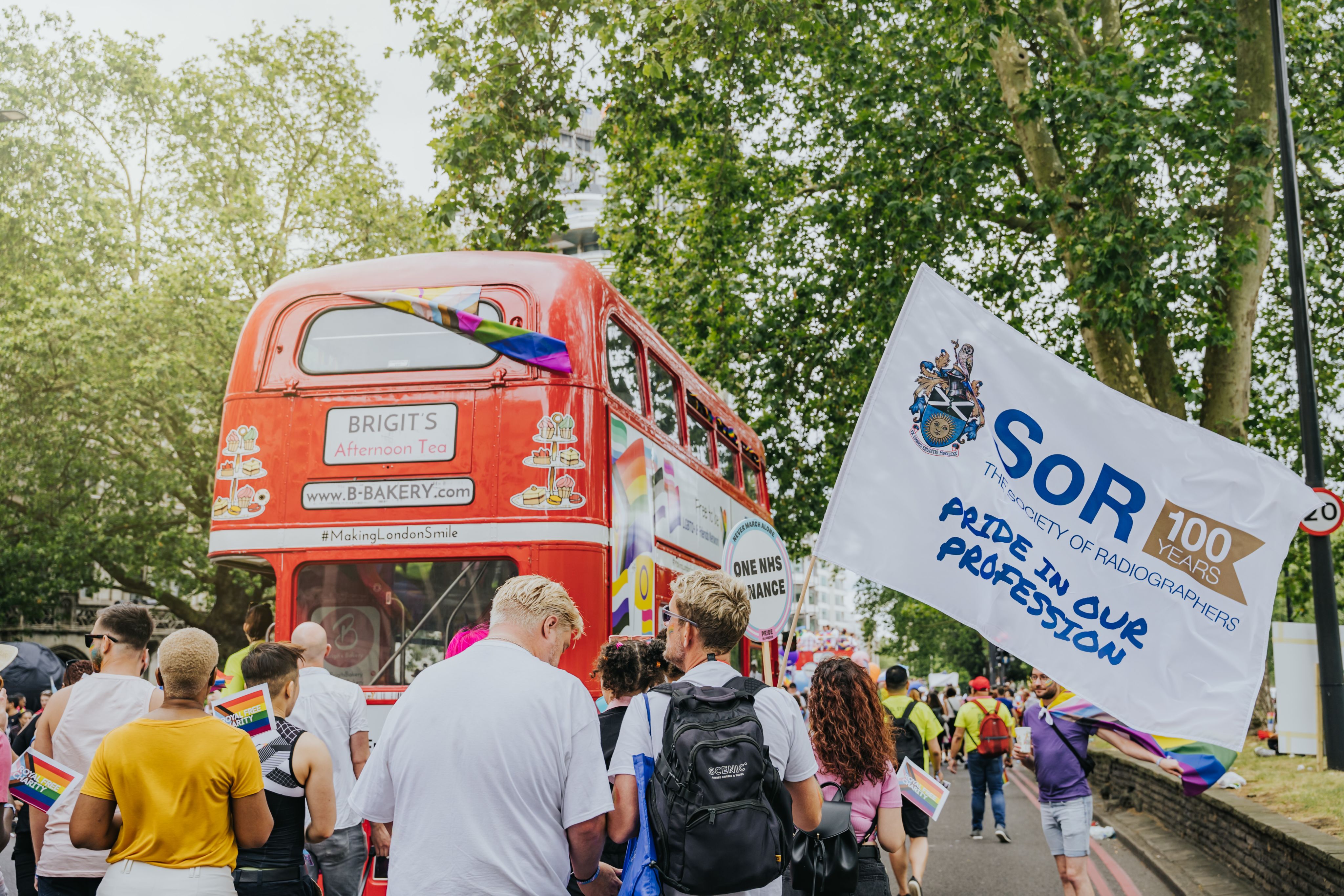London double decker bus with Pride promotion and  large SOR flag flying