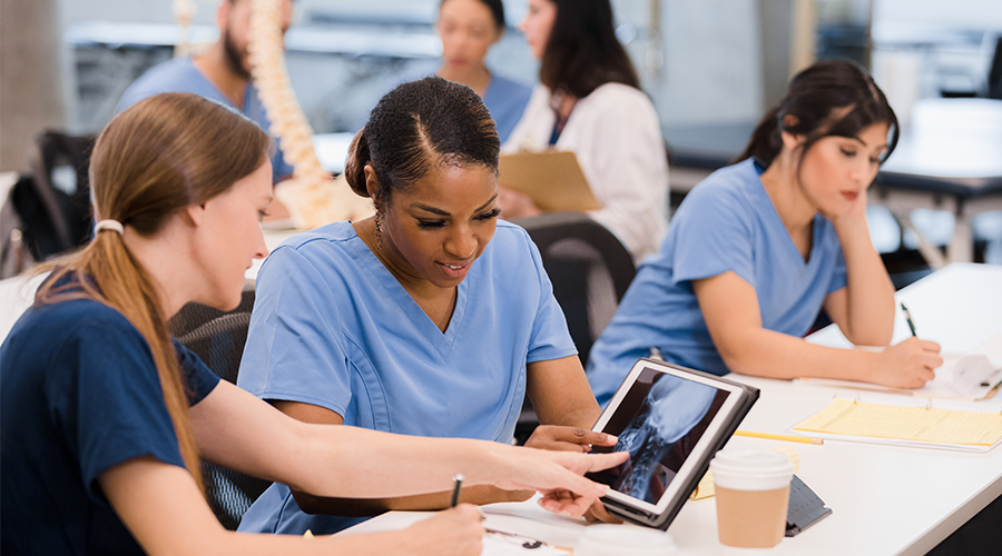 Radiography students learning on tablet